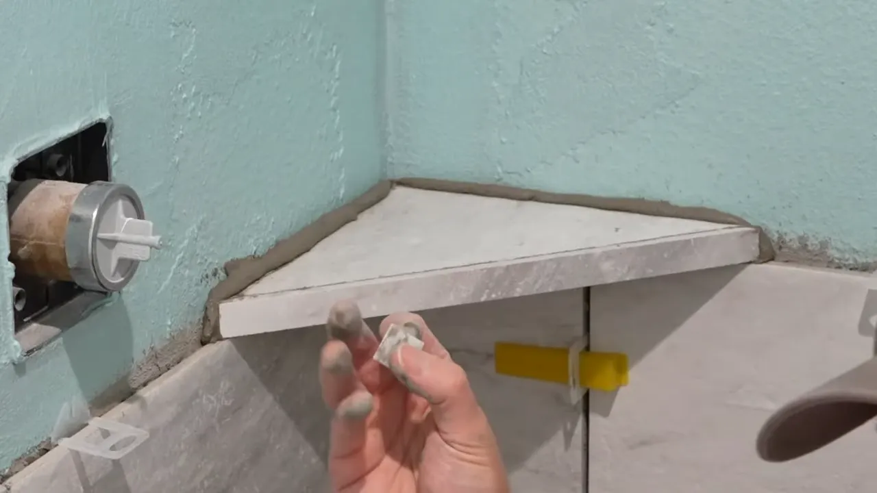 How to Effortlessly Install a Corner Shelf in Your Shower