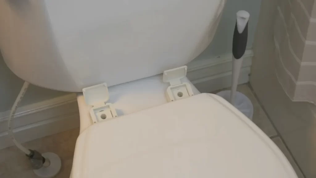 Attaching The Toilet Seat To The Bowl