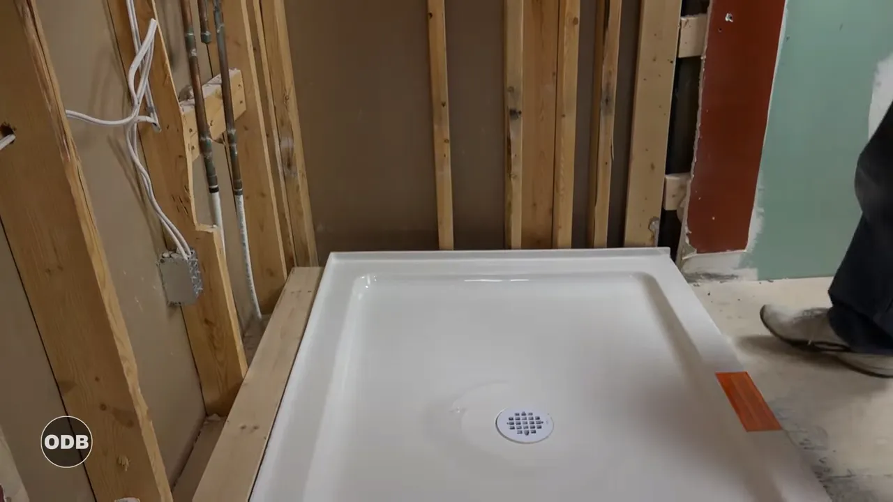 How to Easily Install a Fiberglass Shower Pan: Step-by-Step Video Guide!