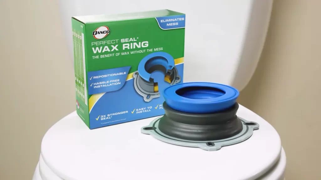 Lowering The Toilet Onto The Wax Ring